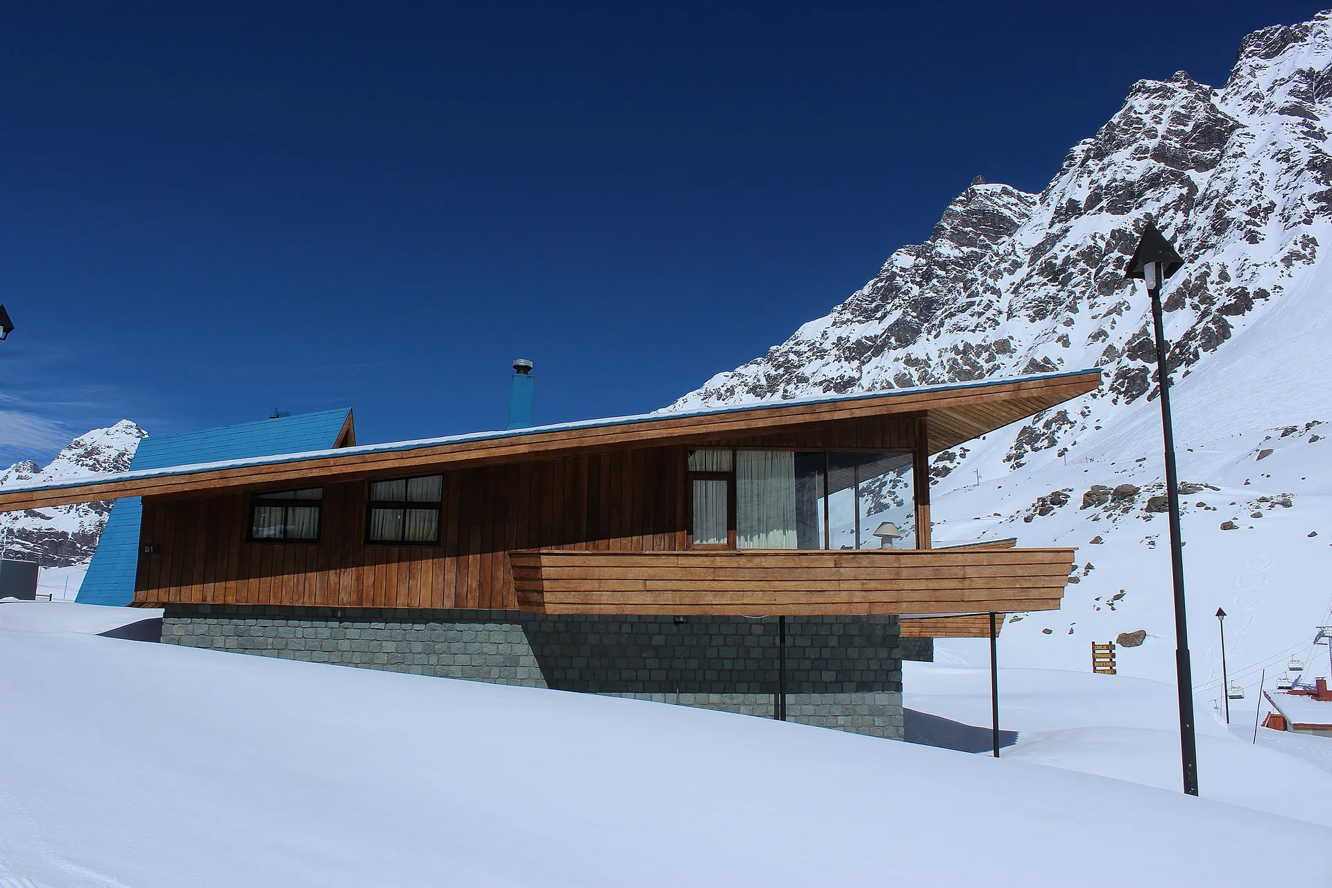 Alpine chalet with mountain backdrop