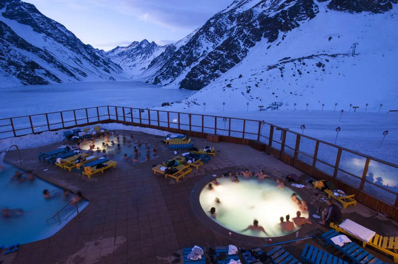 Evening hot tubs with frozen lake view