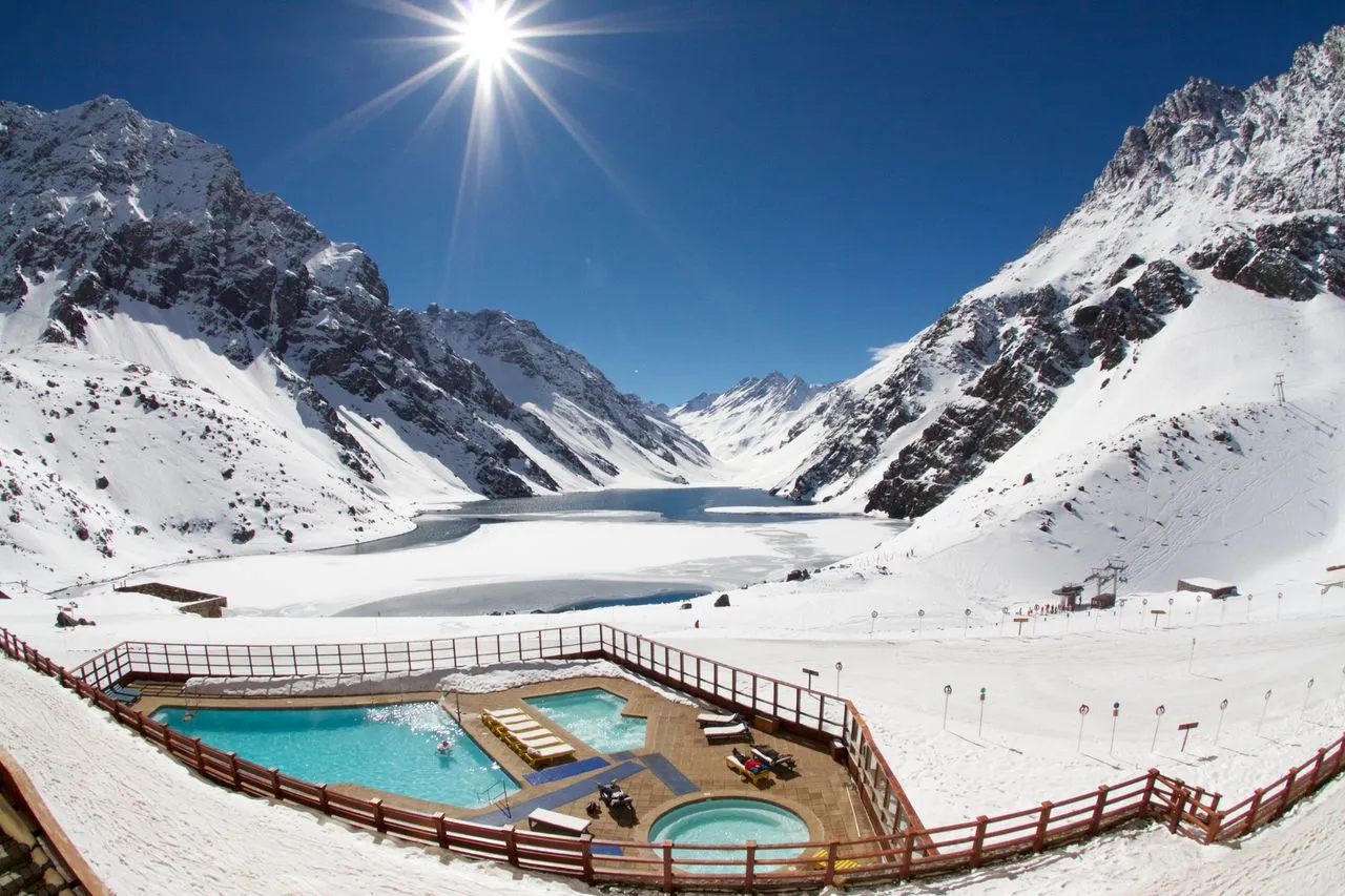 Wide angle sun starburst over pool